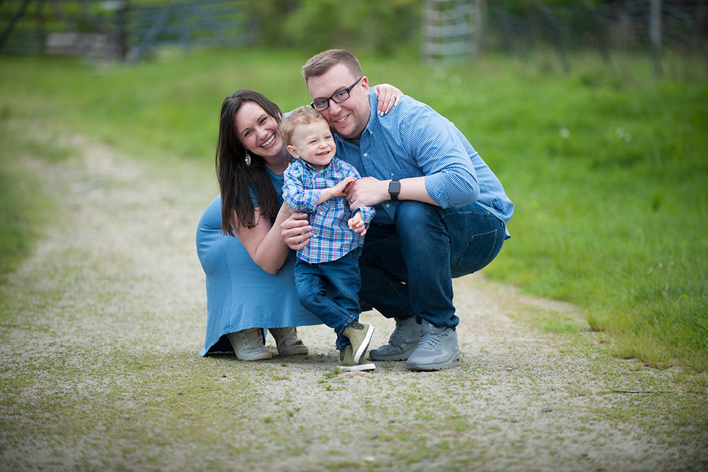 An MGfC patient poses with his parents