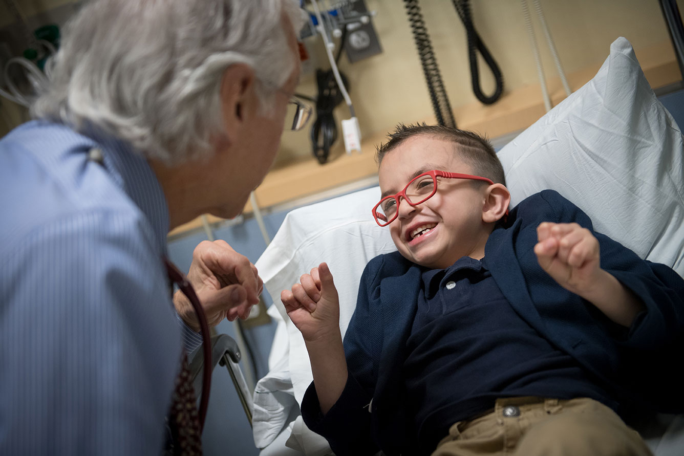 An MGfC patient smiles at his doctor