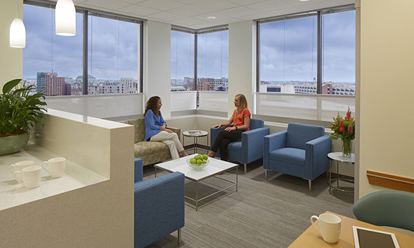 Two women seated, talking to each other Two women seated, talking to each other